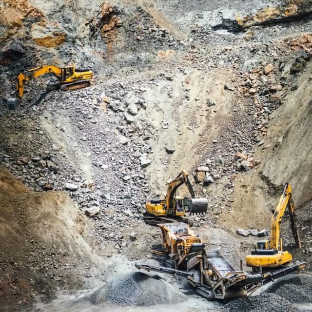 Dynamic Metals & Mining Operations: Gleaming machinery against a backdrop of rugged terrain.